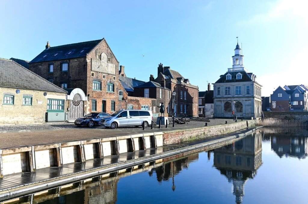 White car by the canal