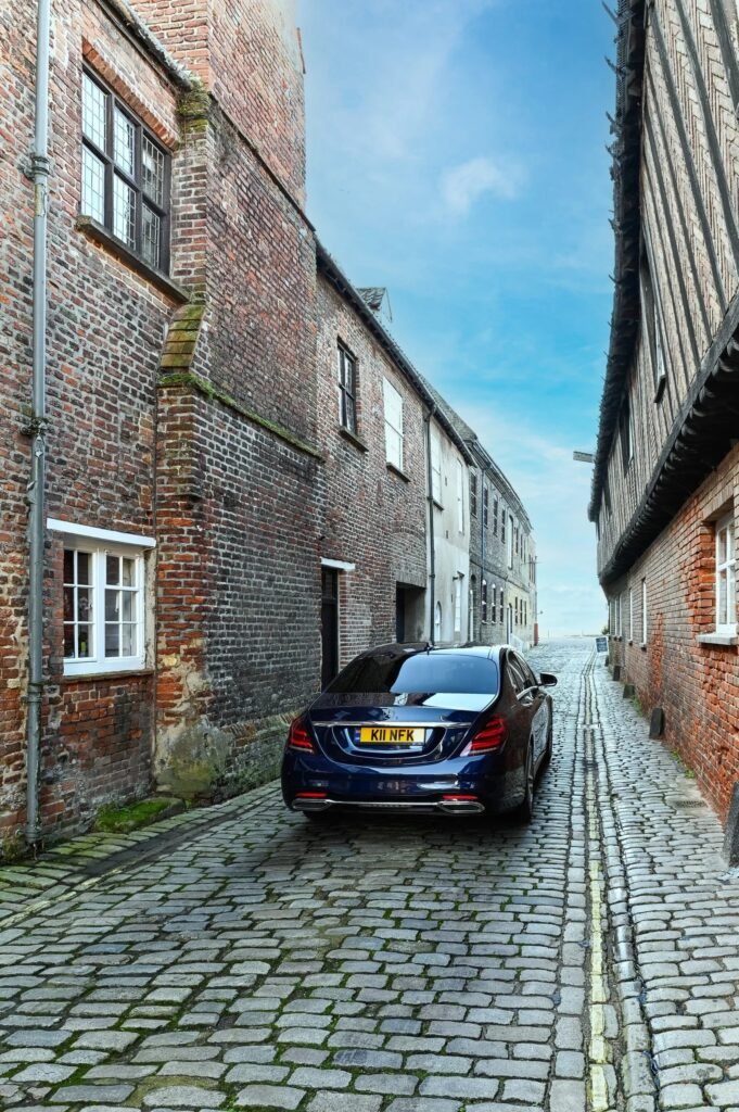Black car in a narrow street